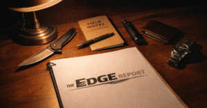 The Edge Report notebook, pen, and tools on wooden desk for investigative journalism.